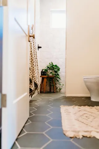 a bathroom with a toilet and a bathtub