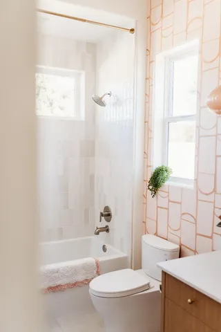 a picture of a bathroom with a shower curtain
