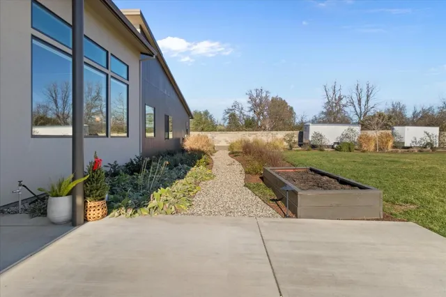 a view of a house with yard and ocean view