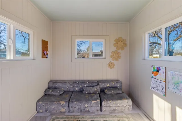 a view of a yard with a large tree