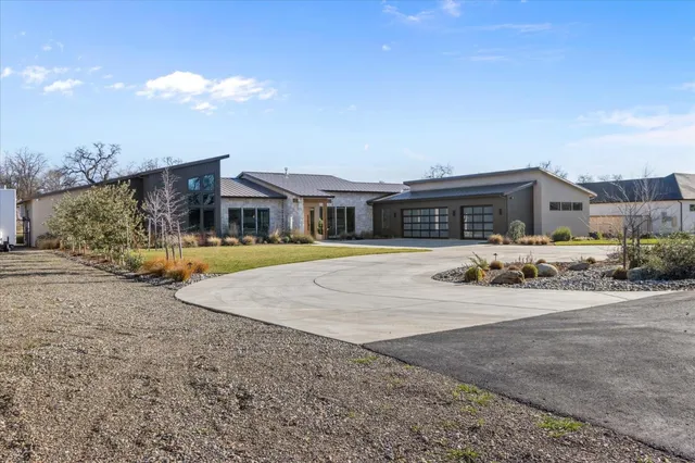 a view of a swimming pool and a chairs in patio