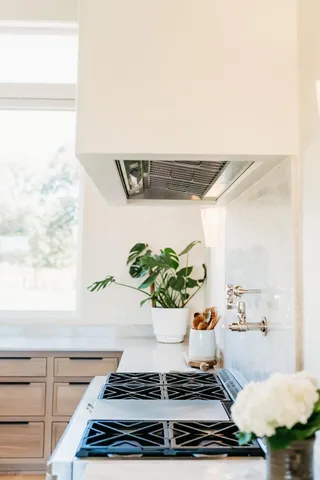 a kitchen with a window a sink and a refrigerator