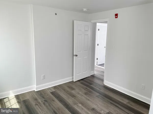 an empty room with wooden floor