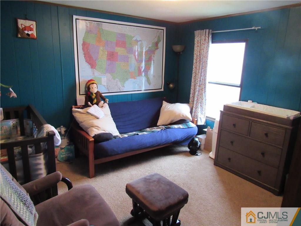 37 Whitman Road, Unit 37 North Brunswick, NJ 08902 - Photo 14 of 20 a living room with furniture and a gate