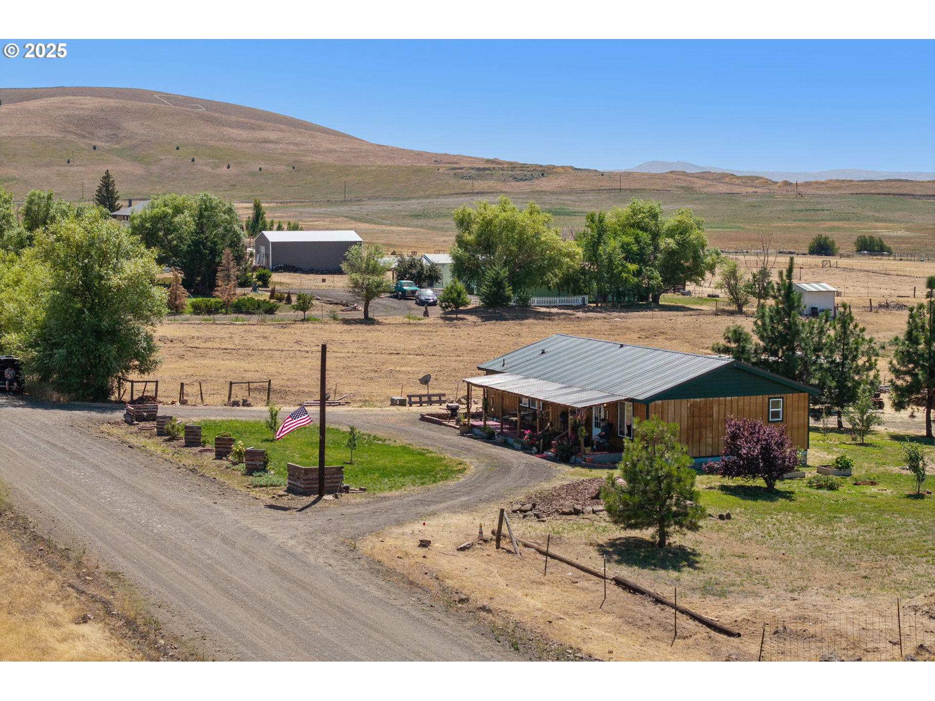 115 Sunset Drive Goldendale, WA 98620 - Photo 24 of 48 a view of a house with a yard and mountain