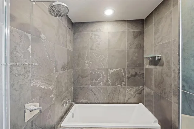 a bathroom with a shower and a toilet