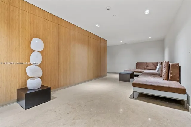 a bedroom with bed and chair