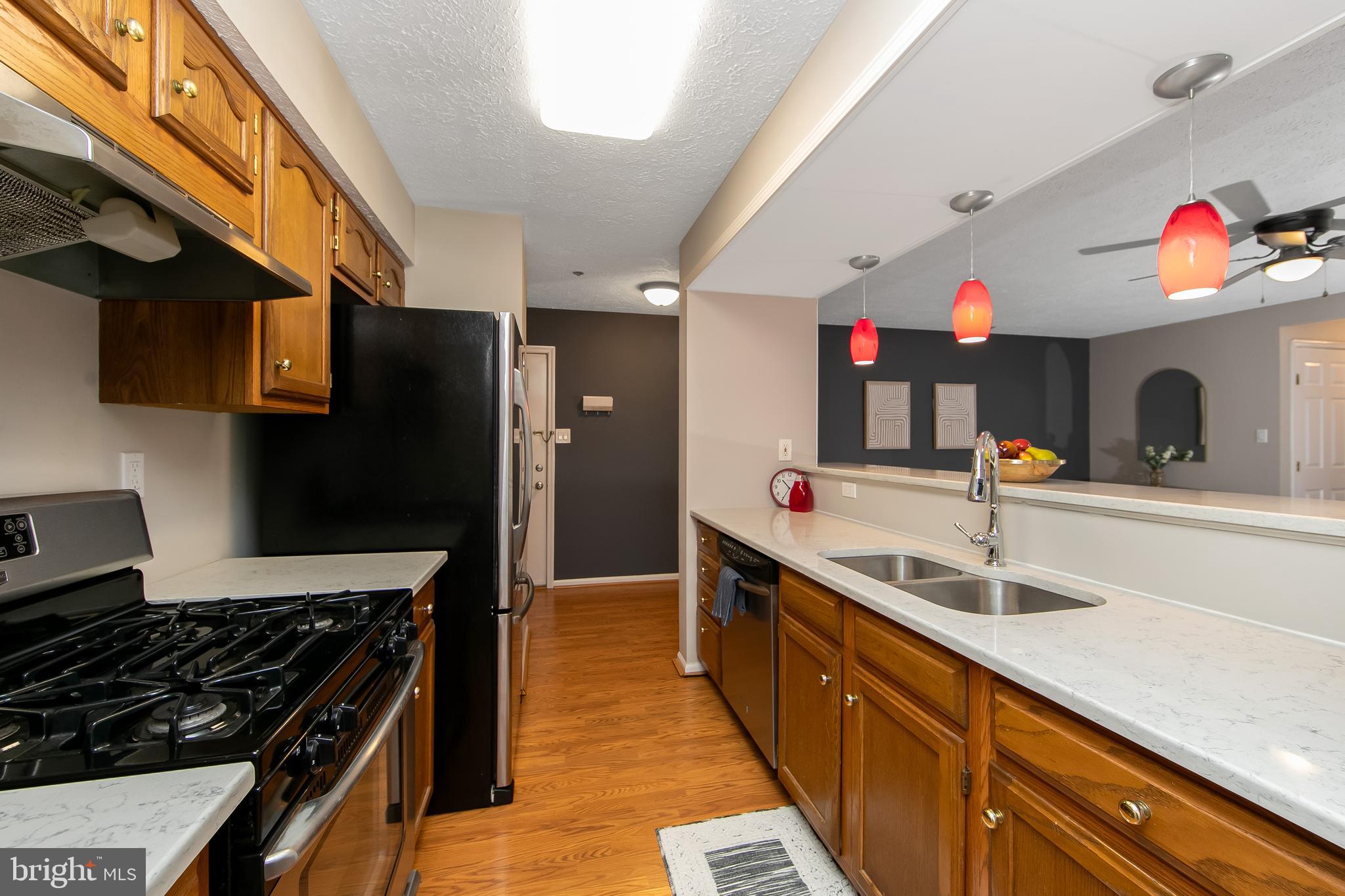 8 Inverness Circle Marlton, NJ 08053 - Photo 11 of 39 a kitchen with kitchen island granite countertop a sink and a stove