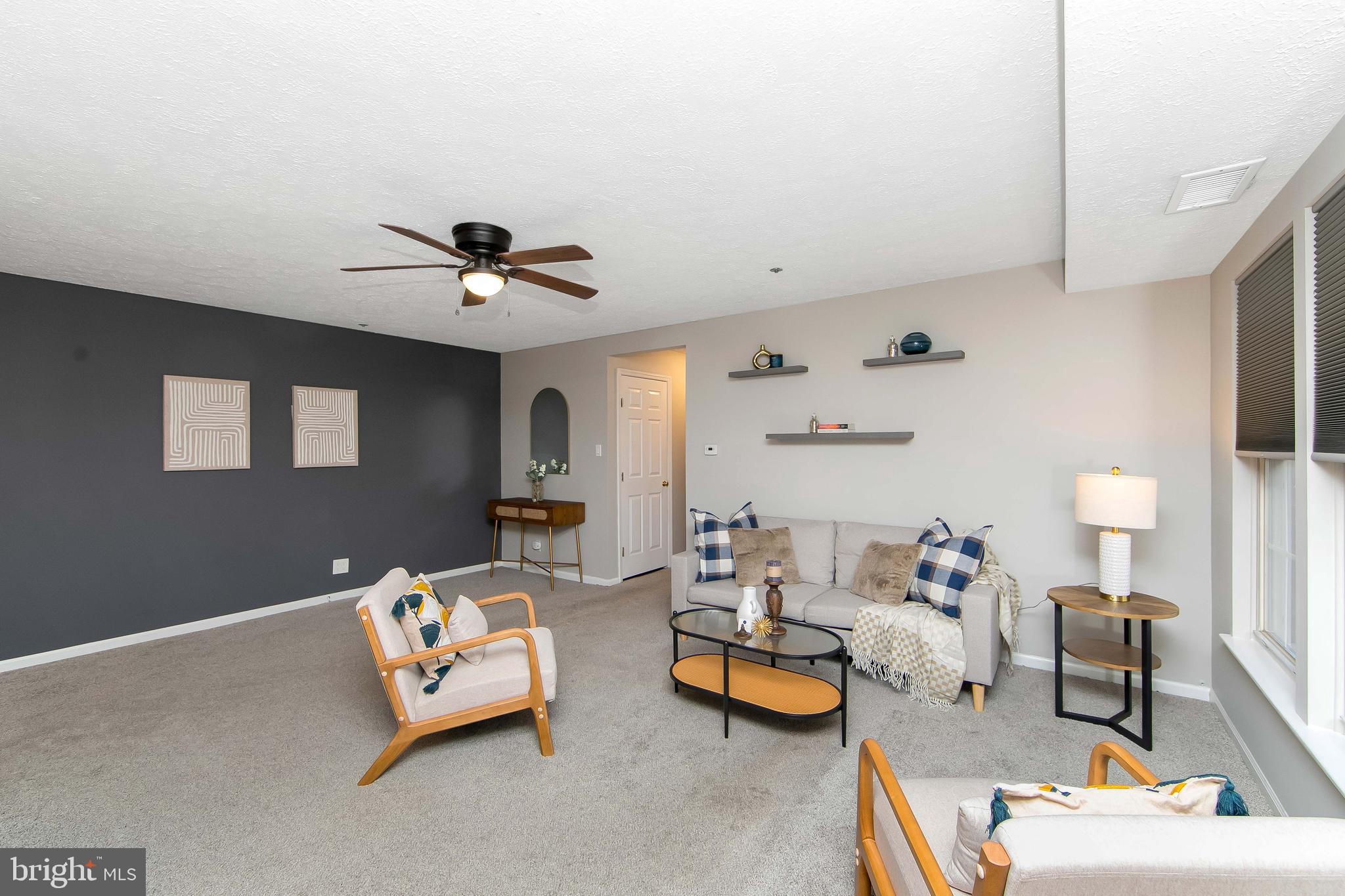 8 Inverness Circle Marlton, NJ 08053 - Photo 3 of 39 a living room with furniture and a chandelier