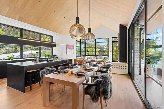 a very nice looking room with a large window and sitting space