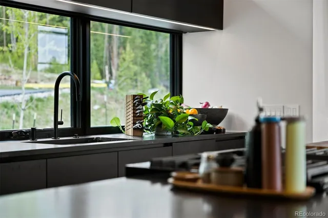 a room with a large window and pool table