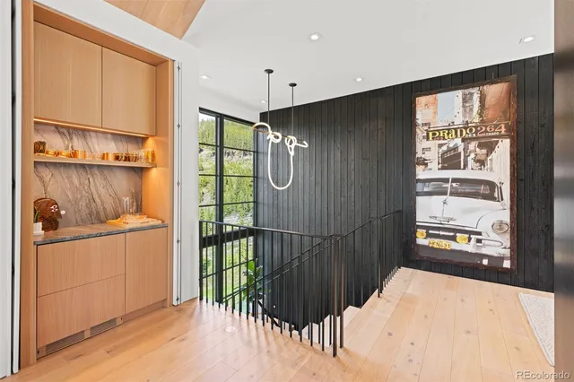 a hallway with sliding door and front door