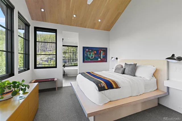 a bedroom with bed and balcony