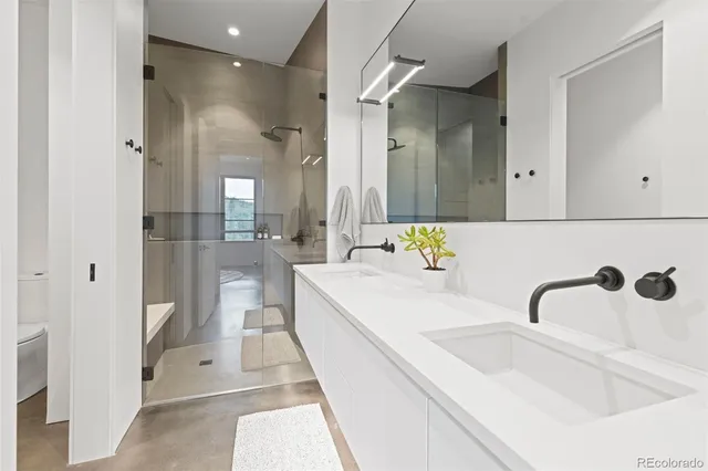 a bedroom with two beds and a large window