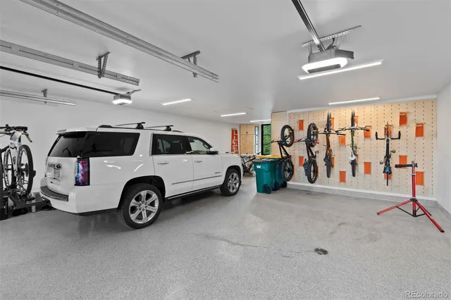 a view of a two chairs in a backyard