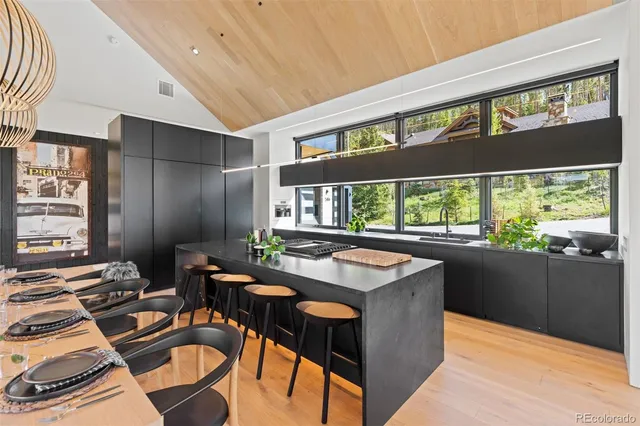 a kitchen with a stove a sink and a refrigerator