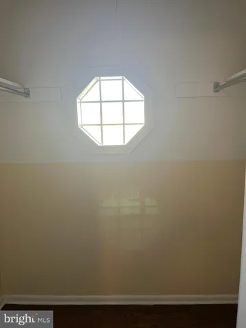 an empty room with a fireplace