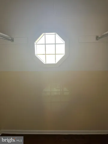 a view of an empty room with a fireplace