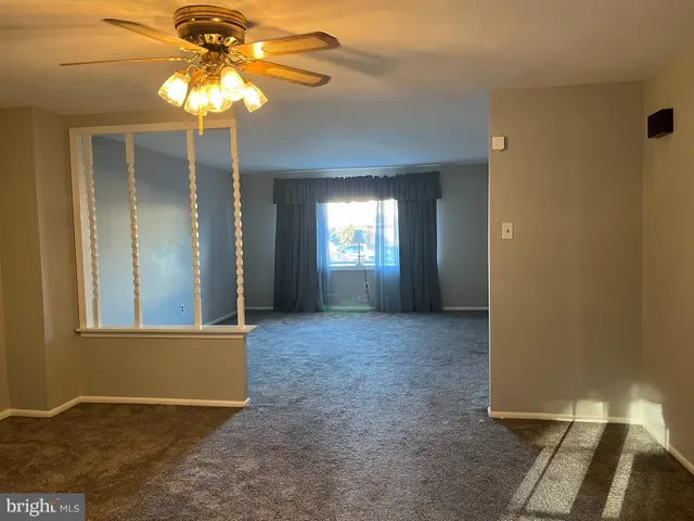 a kitchen with stainless steel appliances a refrigerator and a stove