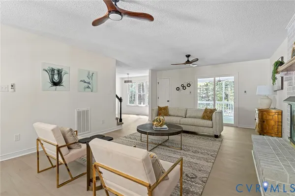 a living room with furniture and a rug