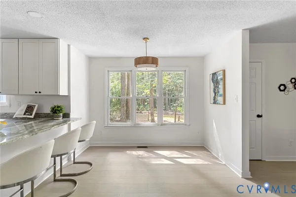 a kitchen that has a lot of cabinets in it with granite countertop cabinets