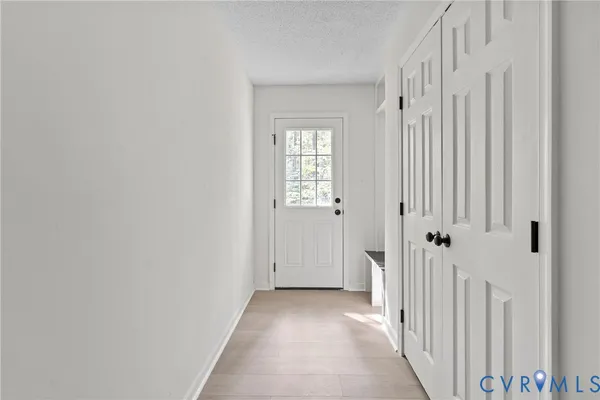 a view of a hallway with a white door