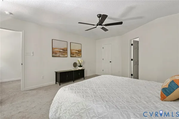 a bedroom with a bed and a dresser