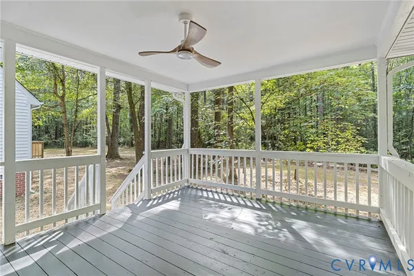 a view of a porch with wooden floor and outdoor space
