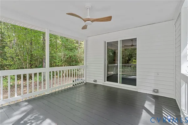 a view of a porch with wooden floor and outdoor space