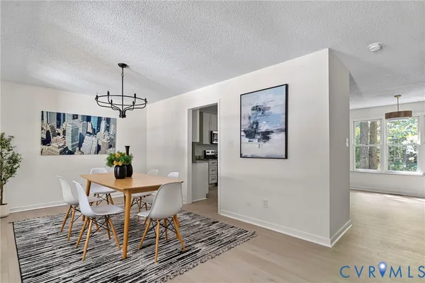 a view of a dining room with furniture and window