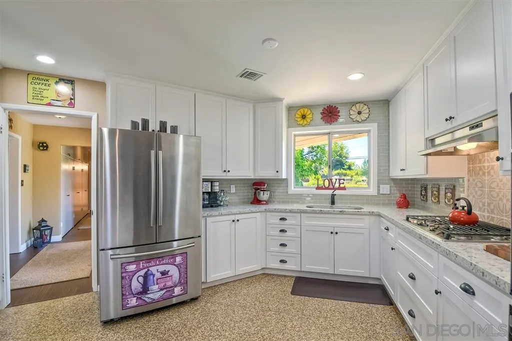 1651 Highlands View Road Alpine, CA 91901 - Photo 13 of 25 a kitchen with refrigerator cabinets and window