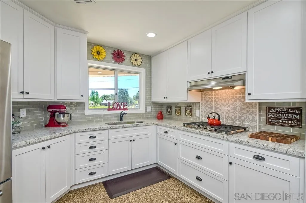 1651 Highlands View Road Alpine, CA 91901 - Photo 14 of 25 a kitchen with cabinets appliances a sink and a window