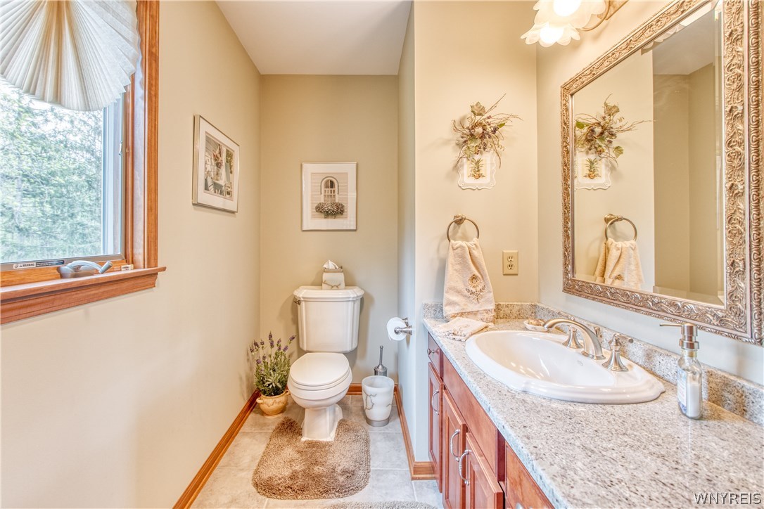 4535 Lower River Road Lewiston, NY 14092 - Photo 25 of 32 Guest bathroom with granite counters and granite f