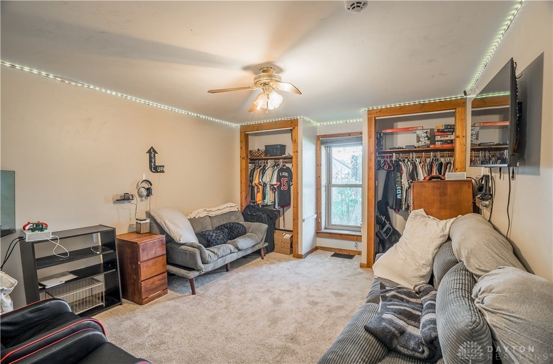 220 Racer Street Troy, OH 45373 - Photo 9 of 33 This inviting bedroom features ample space and dual closets creating a comfortable living area.