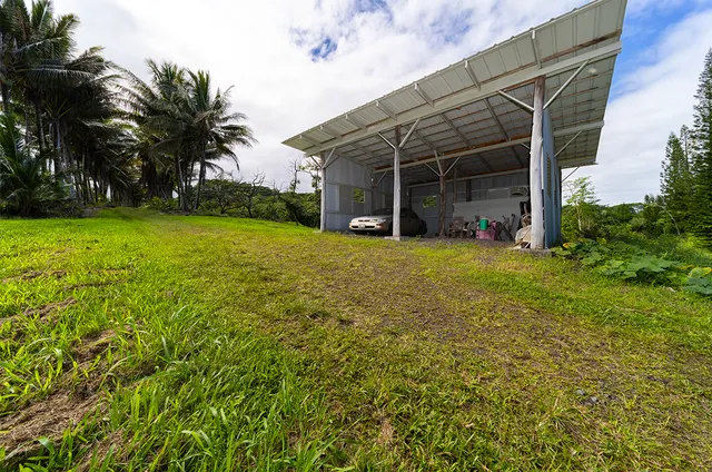 a view of backyard with barbeque grill and stairs