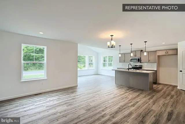 a view of kitchen and kitchen with furniture wooden floor and window