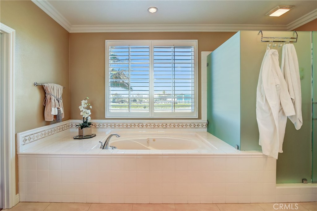 47 Snowdrop Tree Irvine, CA 92606 - Photo 15 of 29 a white bath tub sitting in a bathroom next to a window
