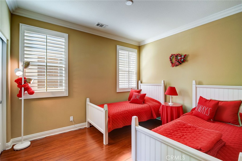 47 Snowdrop Tree Irvine, CA 92606 - Photo 16 of 29 a bedroom with two beds and a window