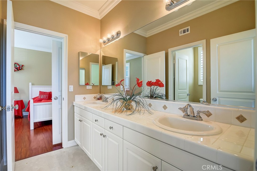 47 Snowdrop Tree Irvine, CA 92606 - Photo 18 of 29 a bathroom with a sink and a mirror