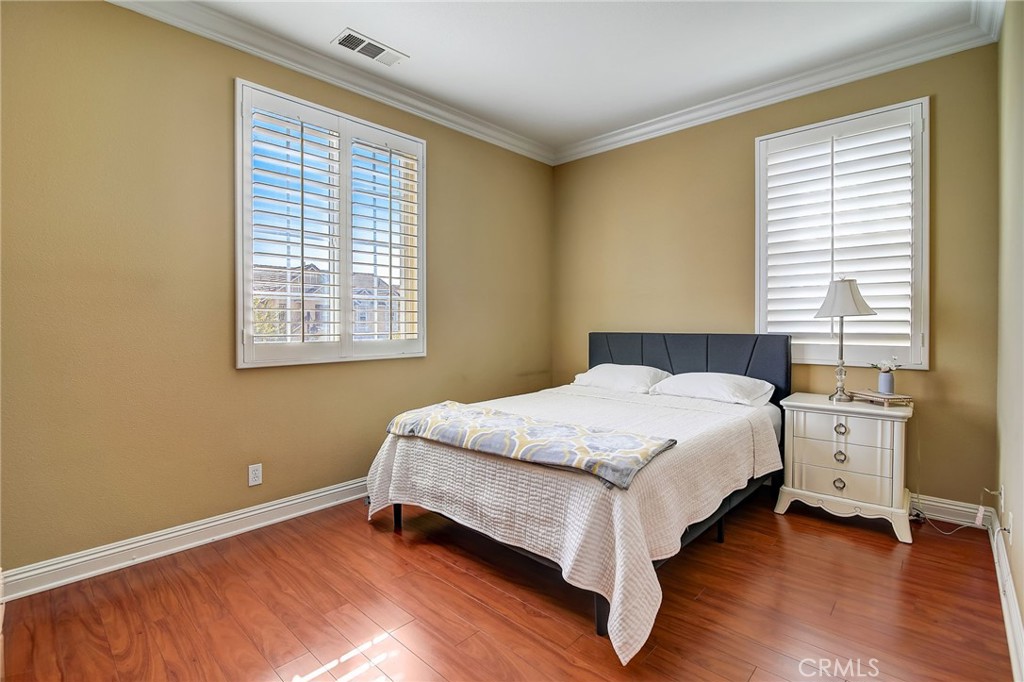 47 Snowdrop Tree Irvine, CA 92606 - Photo 19 of 29 a bed sitting in a bedroom next to a window