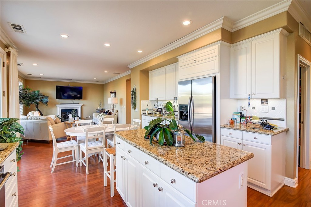47 Snowdrop Tree Irvine, CA 92606 - Photo 2 of 29 a kitchen with stainless steel appliances granite countertop sink stove top oven and cabinets