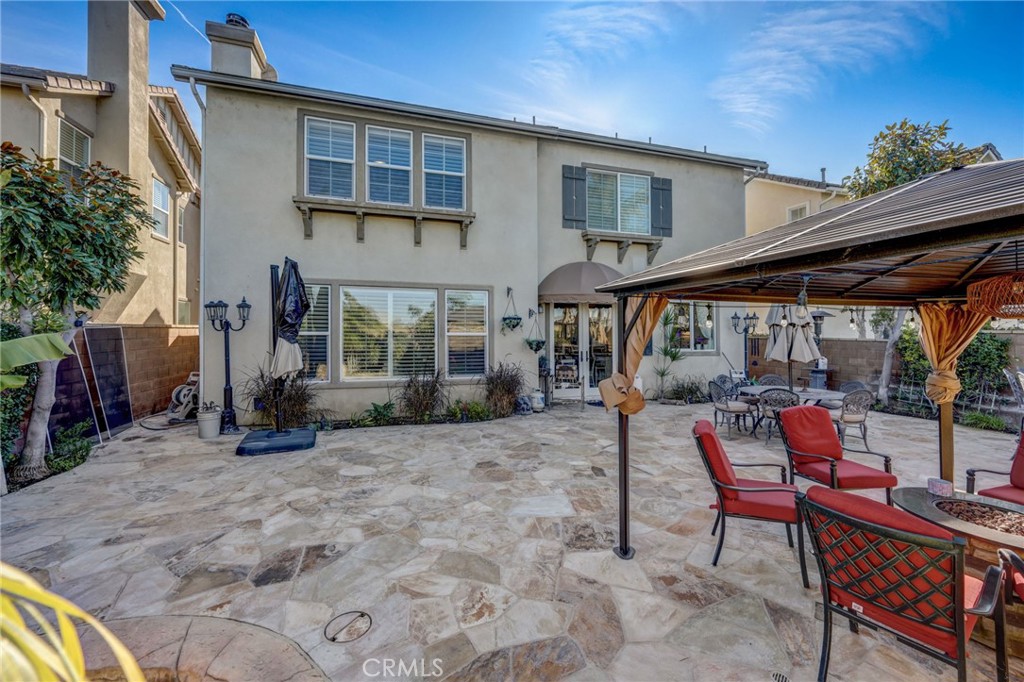 47 Snowdrop Tree Irvine, CA 92606 - Photo 21 of 29 a view of house with a patio