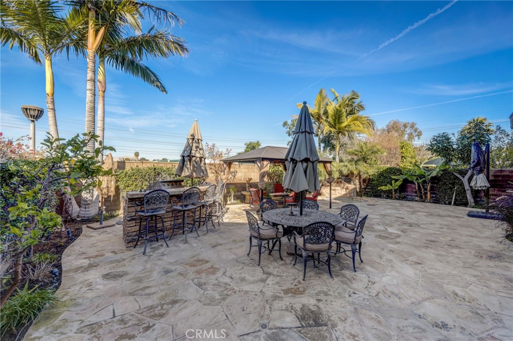 47 Snowdrop Tree Irvine, CA 92606 - Photo 23 of 29 a view of a tables and chairs in patio