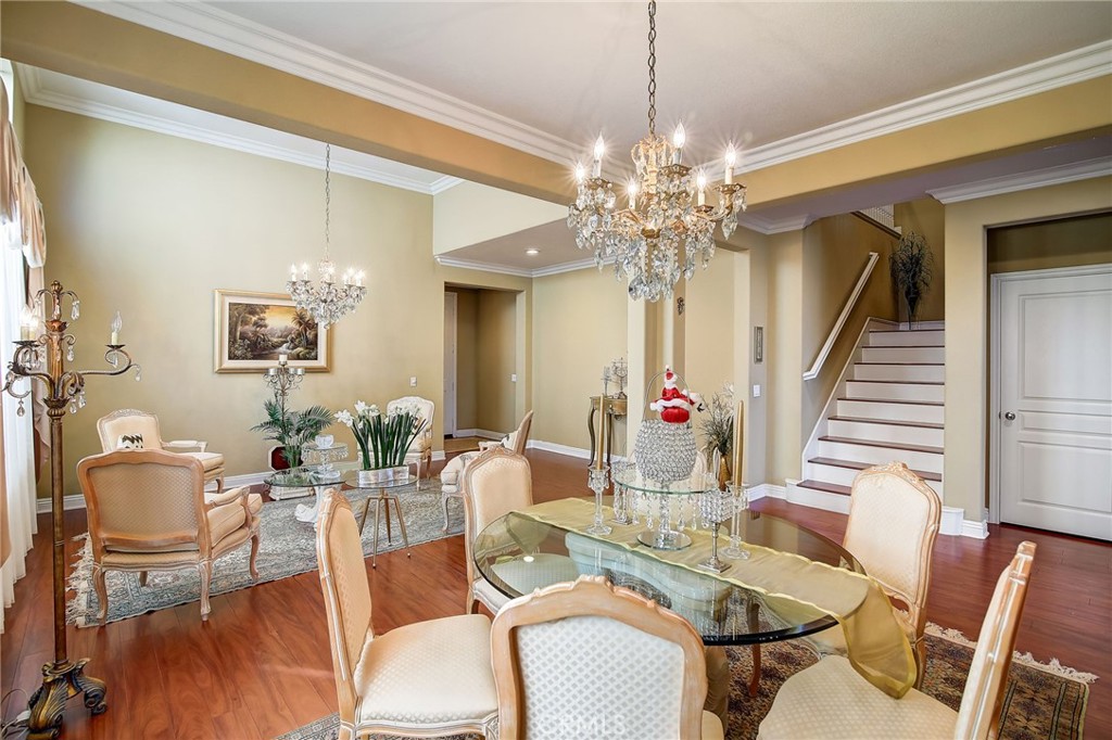 47 Snowdrop Tree Irvine, CA 92606 - Photo 4 of 29 a view of a dining room with furniture and chandelier