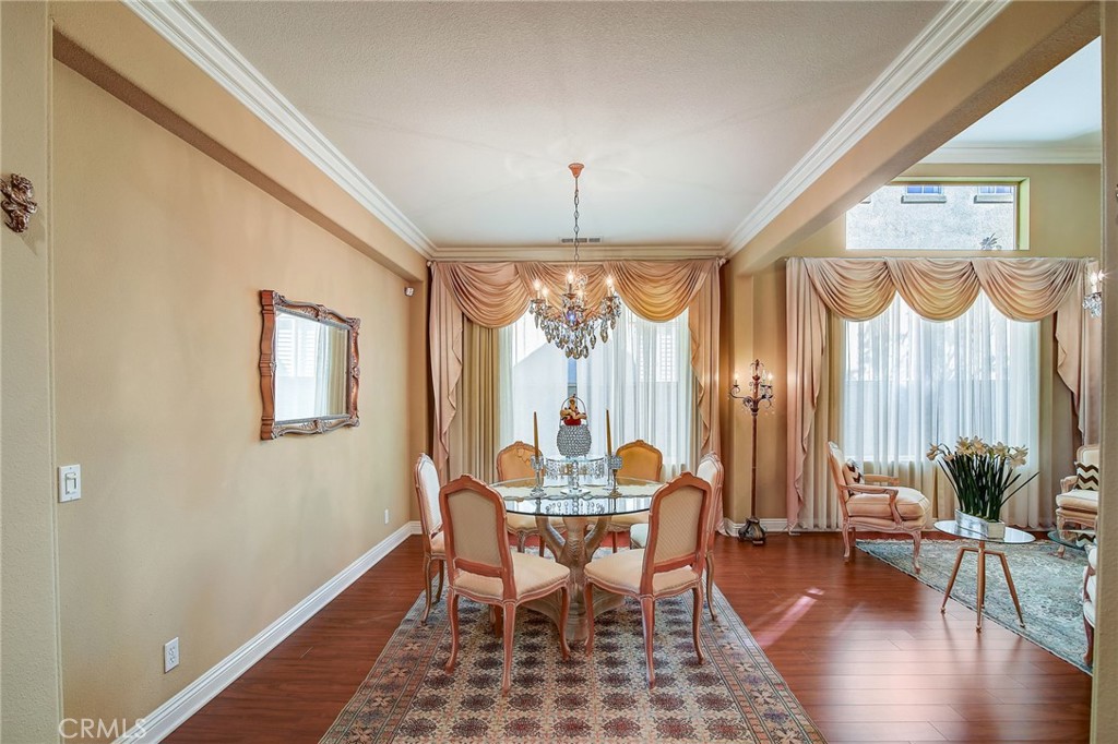 47 Snowdrop Tree Irvine, CA 92606 - Photo 7 of 29 a view of a dining room with furniture window and wooden floor