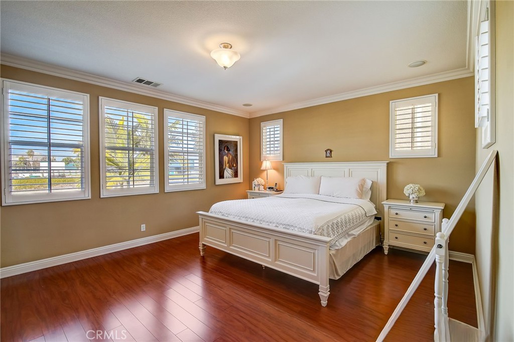 47 Snowdrop Tree Irvine, CA 92606 - Photo 8 of 29 a bedroom with a bed and windows