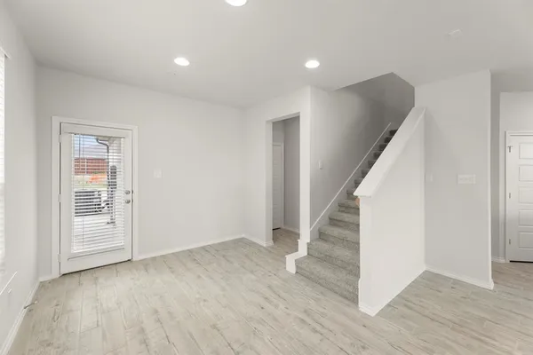a view of entryway with wooden floor