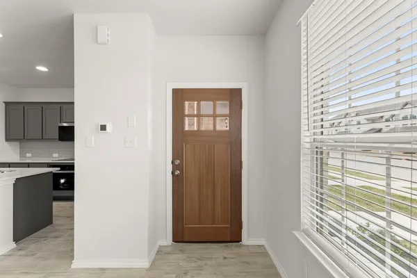 a view of a kitchen from the hallway