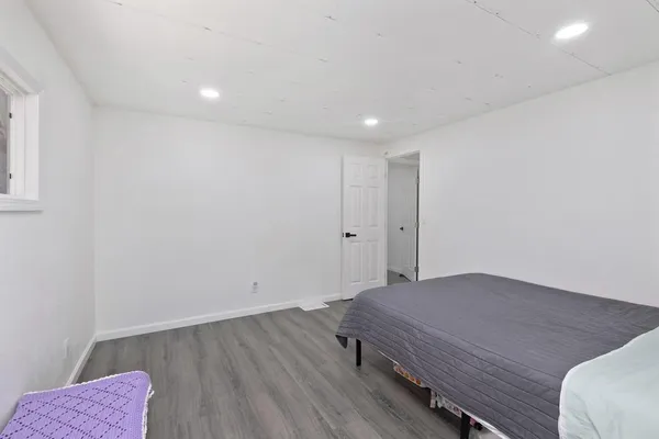 a view of a room with wooden floor