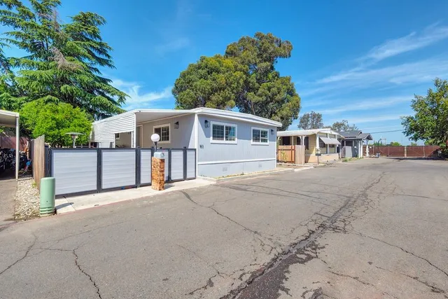 a view of a wrought iron fences in front of house